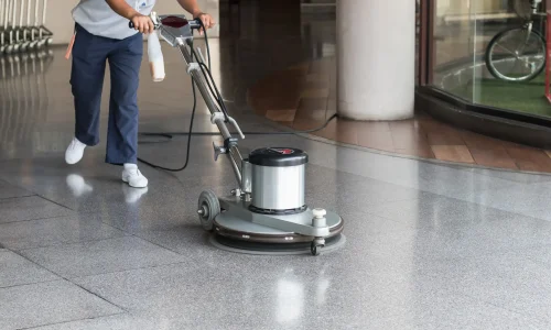 woman-worker-cleaning-floor-with-polishing-machine